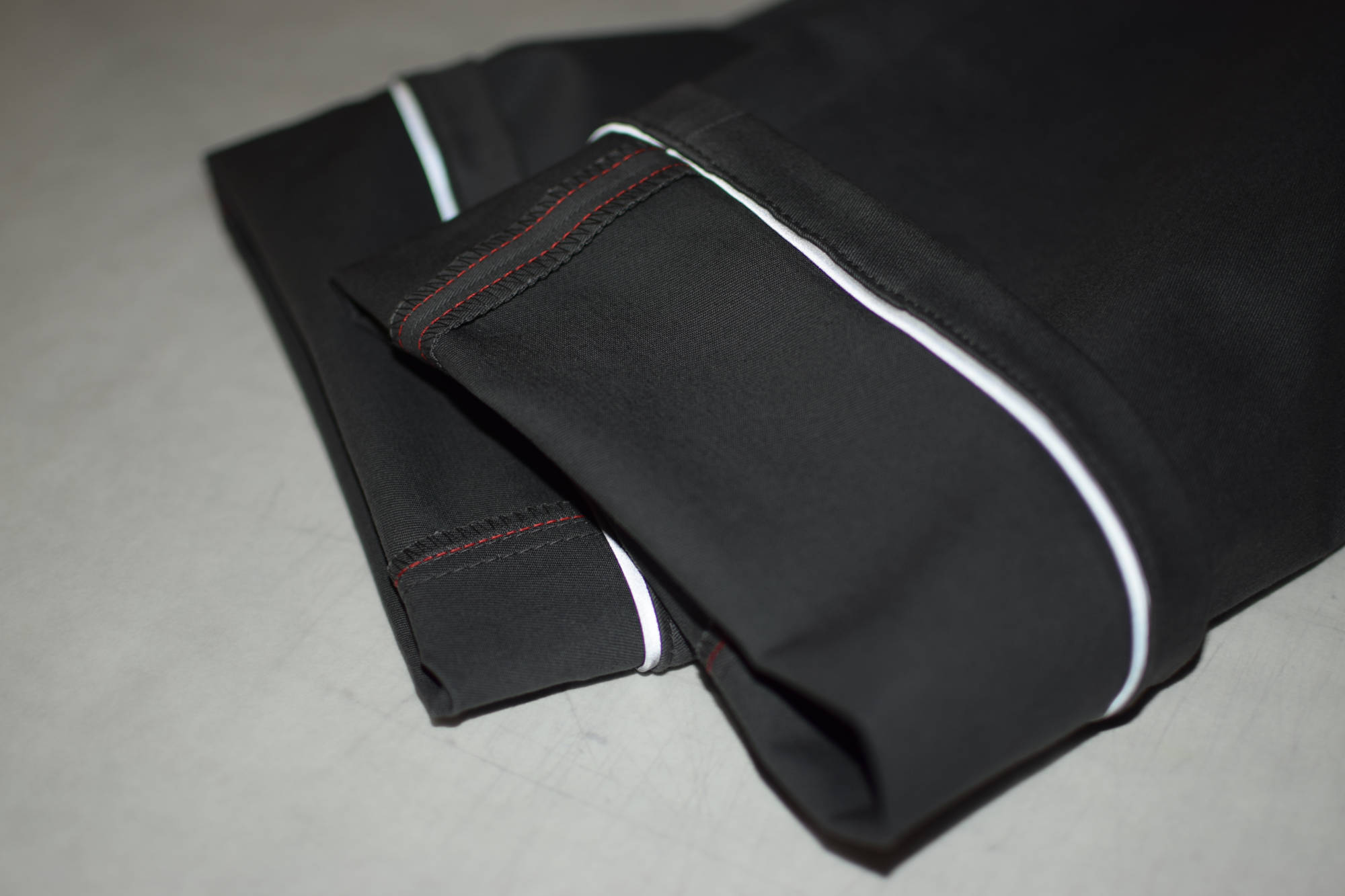 Some super nice grey twill commuter cycling chino trousers by indnat with reflecting webbing.