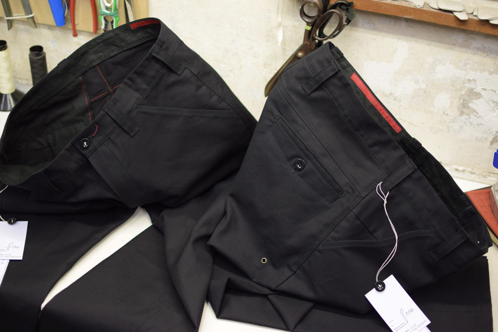 a set of two black moleskin trousers with super nice details made by indnat